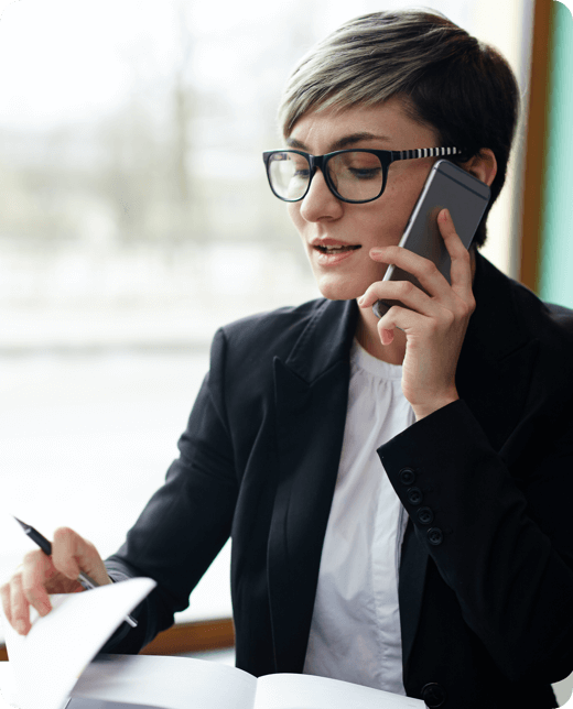 A smiling man with phone call in check shirt