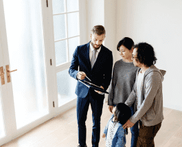 a person showing real estate to customers